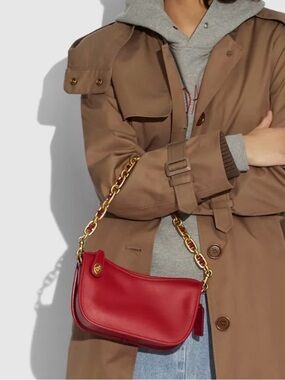 Coach Swinger Bag
With Chain.  Color wine New no tag .